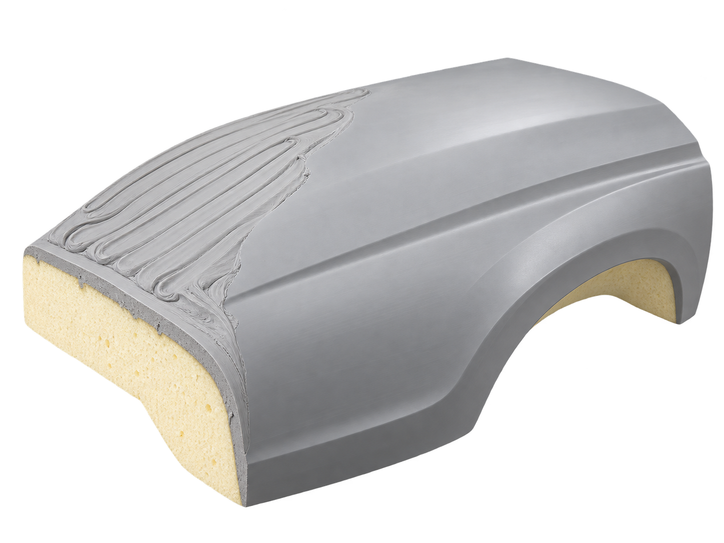 Grey epoxy modelling paste over a foam core, showing applied and machined surfaces